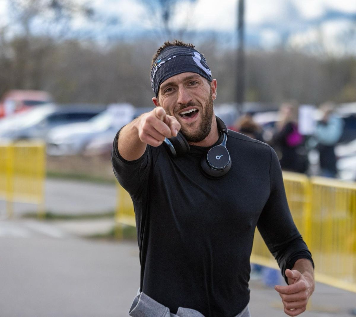 Brandon mid-race, pointing at the camera